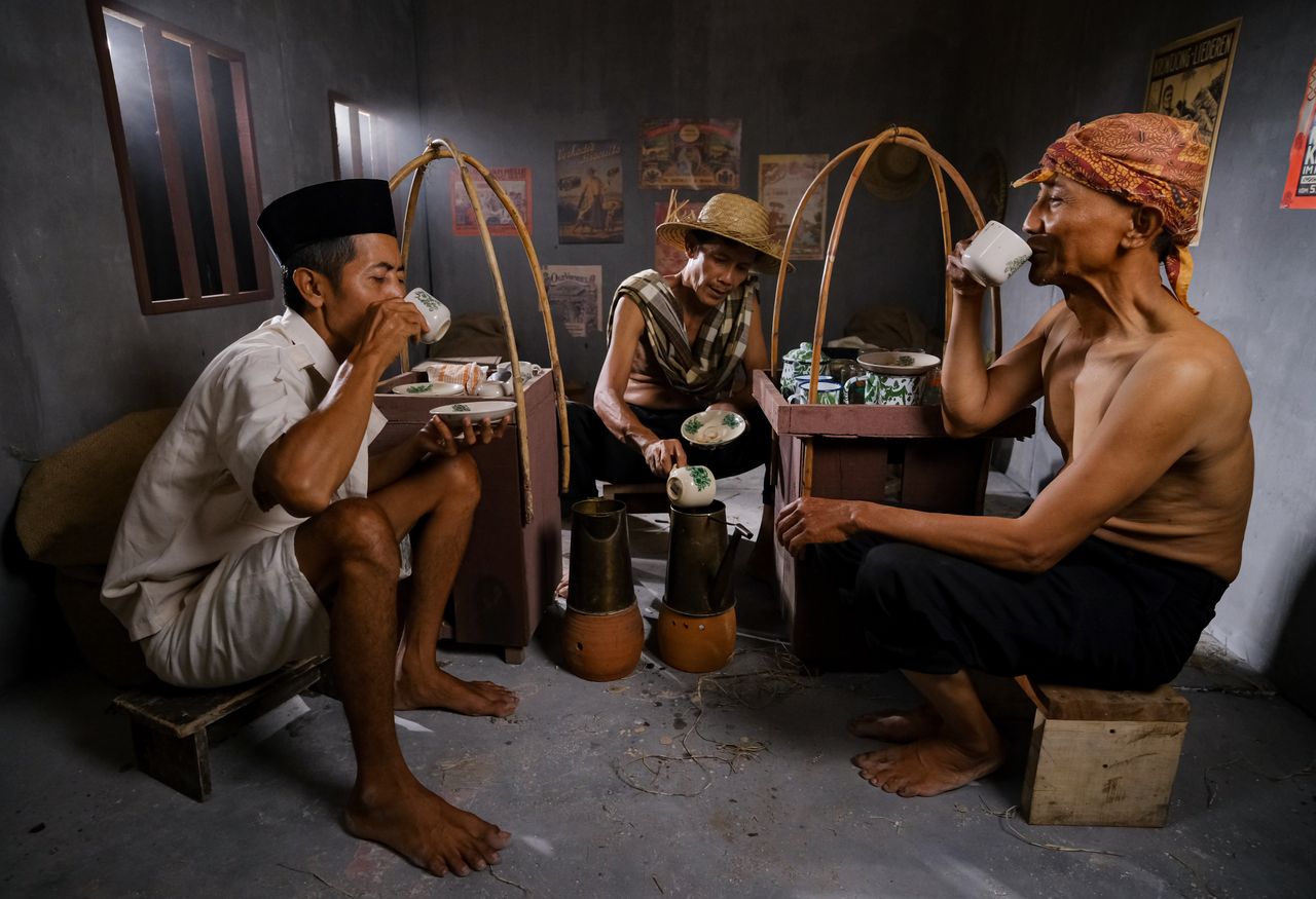 About Men enjoying a coffee break, showcasing traditional culture in East Jakarta.